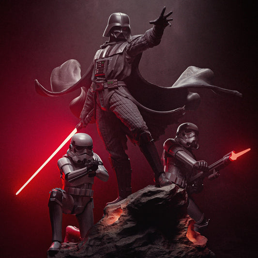 Darth Vader figurine standing atop a rocky base with two stormtroopers, wielding a red lightsaber and extending his hand.