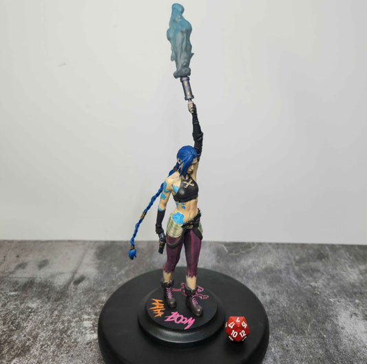 Painted Jinx figurine recreating her iconic Arcane scene atop the tower, holding a glowing blue flare with intricate details.