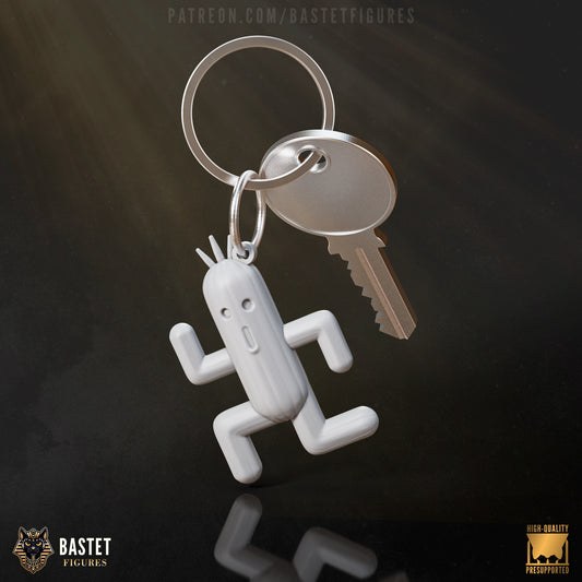 Cactuar keychain inspired by Final Fantasy, showing a small running Cactuar charm attached to a metal keyring and key, displayed on a dark reflective surface.