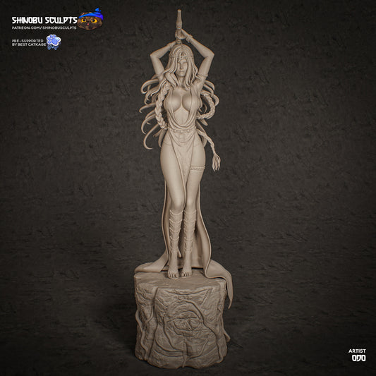 Alt tag: Marika Elden Ring 1:8 scale statue front angle showing raised weapon pose, flowing hair sculpt, draped clothing, and tree-root stone pedestal.