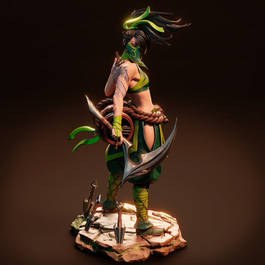 A high-quality collectible figure of Akali from League of Legends, posed dynamically on a stone base with kunai and weapons, wearing a green and black ninja outfit with flowing hair and mask.