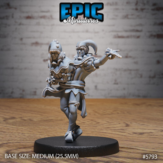 Conjoined Twins fantasy miniature depicting a two-headed jester mid-dance on a 25.5mm base, featuring detailed jester garb, expressive dual faces, and motion-filled sculpting.