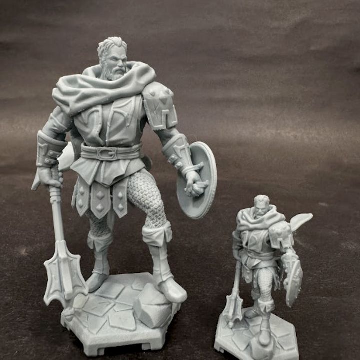 Scale comparison of Greldon miniature in 32mm and 75mm formats, fully assembled with shield, mace, and heroic pose.