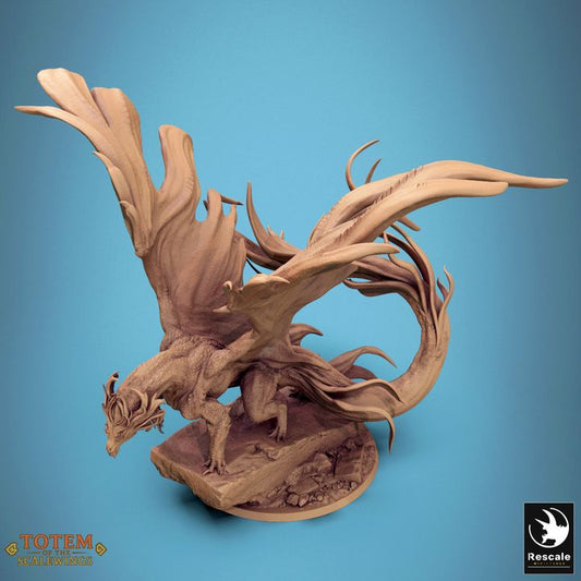 Side view of the Metallic Brass Dragon miniature standing alert with one foot raised, showcasing long wings and flowing tail details.