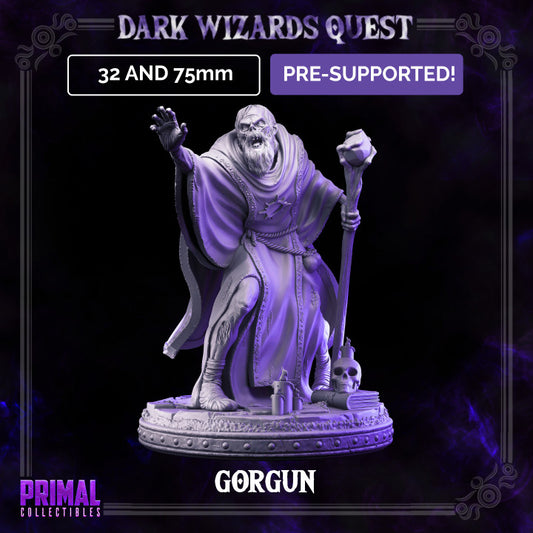 Full-figure front view of Gorgun the undead wizard standing on a detailed base with candles, books, and a skull, wearing a long robe and holding a staff.