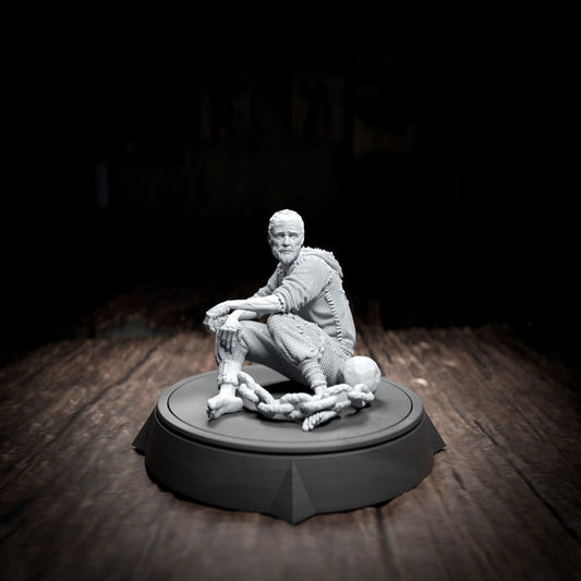 Thon Potts, the prisoner miniature, sitting cross-legged, sporting an annoyed yet wise expression. Perfect for grim TTRPG settings.