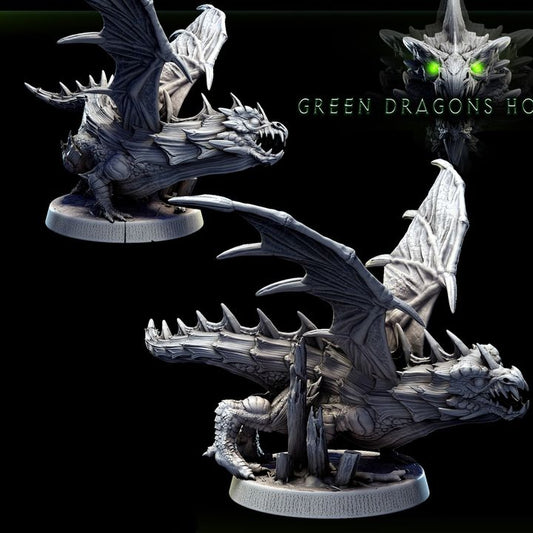 Collage view showing two angles of the crouching young green dragon miniature with wings extended and terrain details on the base.