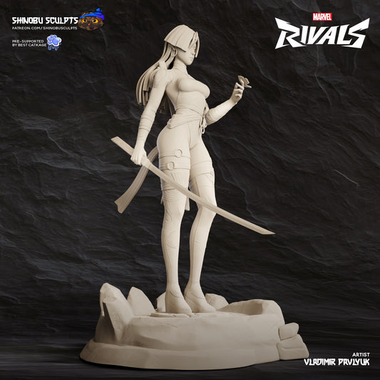 Psylocke Marvel Rivals statue unpainted full-body view holding katana with one hand and psi-butterfly in the other, posed on rocky base.