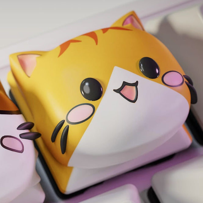 Orange tabby cat artisan keyboard keycap with happy expression on a mechanical keyboard key