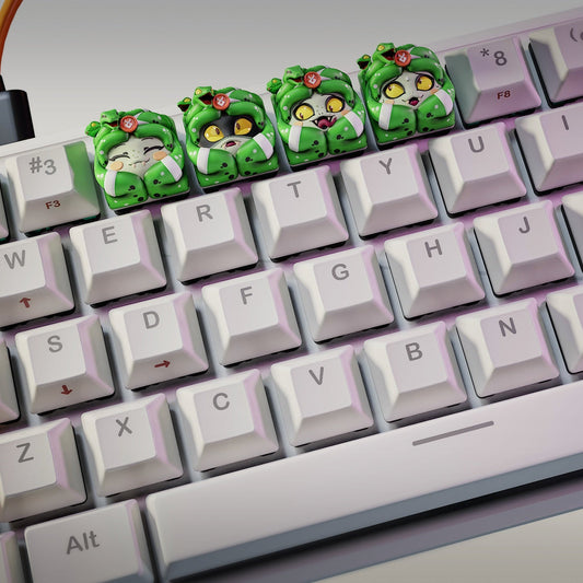 Top-down view of a full keyboard with all four Dusa keycaps placed on the top row between regular keys.