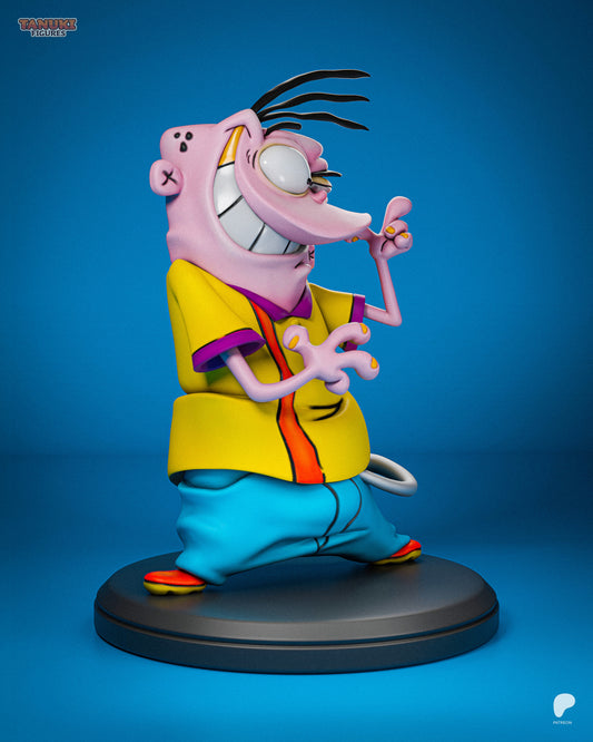 Full front view of Eddy collectible figure on round base, arms raised with fingers curled, wearing baggy blue pants and colorful shoes.