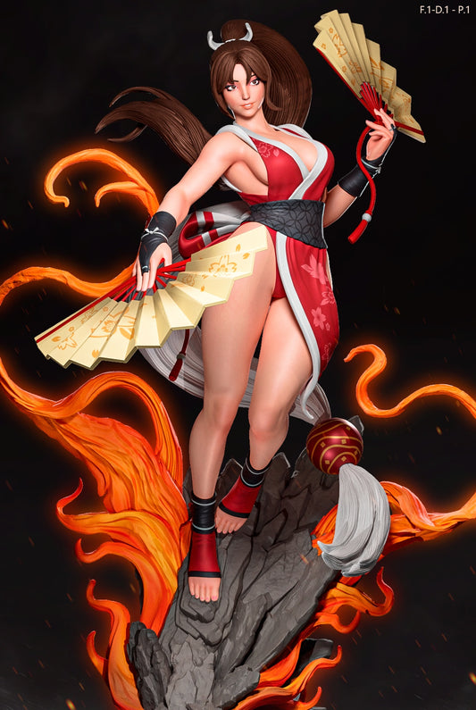Shiranui Mai action pose figure with red kimono, dual fans, flame effects rising from rocky base, Fatal Fury King of Fighters statue