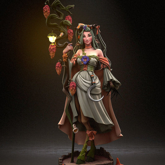 Front view of Fearne figurine in full color, holding a twisted staff with snakes, wearing a flower-adorned dress and standing atop a tree stump base with mushrooms.