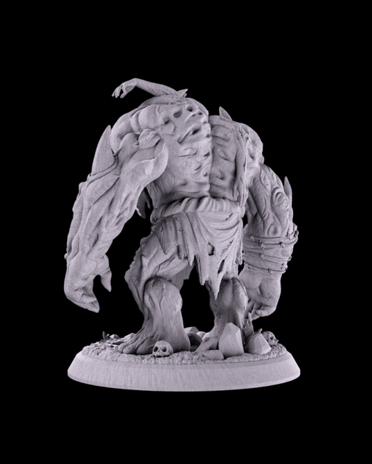 Back view of unpainted Flesh Golem miniature showing bulging muscles, stitched flesh, torn rags, and skulls scattered around the base.