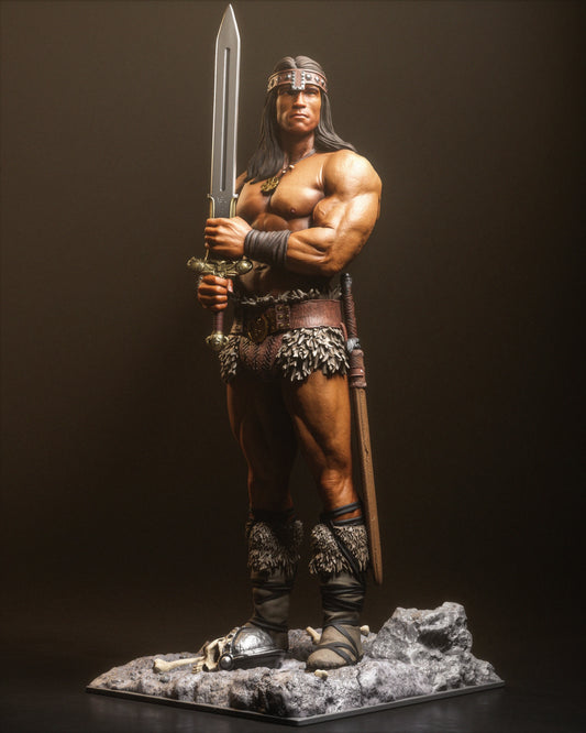 Full front view of Conan standing with broadsword, armored boots, skull and helmet at his feet.
