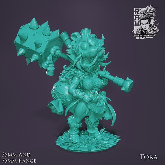 Unpainted render of Tora, female goblin barbarian, wielding a huge spiked hammer and wearing a tiger pelt helmet. She stands on a grassy base in a strong pose, dressed in tribal attire with a large backpack.