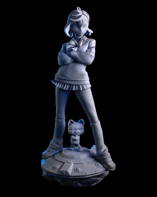 Frontal view of the unpainted Momo Ayase figure in full pose with her arms folded, standing confidently on the UFO base with the cat companion.