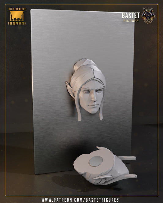 Image 2
Minthara Baldur’s Gate magnet miniature showing elf head sculpt with bun hairstyle displayed on metallic surface