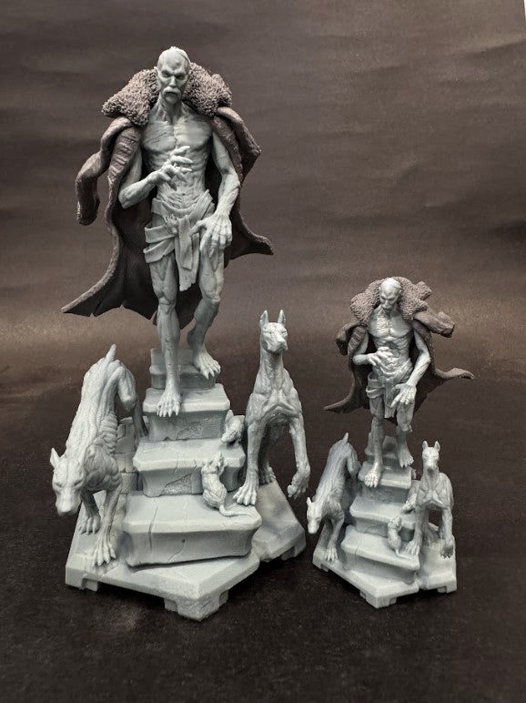 Two printed versions of the Count Orlok-inspired vampire miniature, assembled in different sizes, with eerie hounds and gothic stairway details.