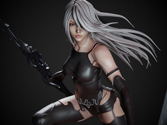 Front view of the painted A2 figure with long silver hair and black bodysuit, standing confidently over enemy wreckage.