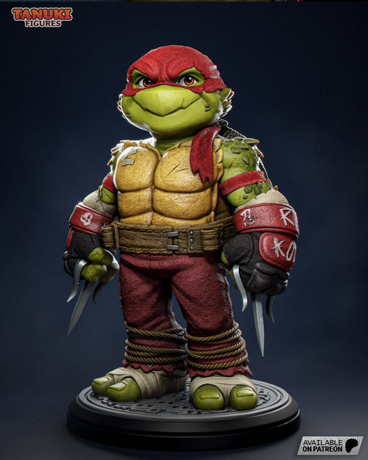Front view of Toon Raphael collectible figure in 1:12 scale, wearing red headband and armored gear, holding dual sai weapons with clenched fists.