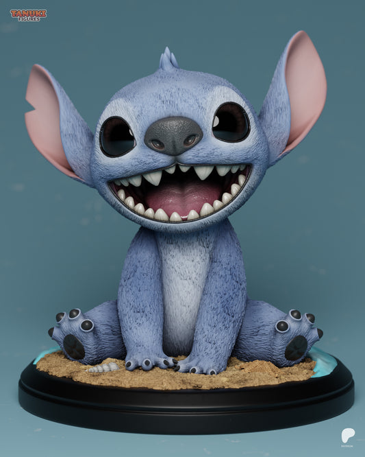 Full front view of Stitch figure sitting on a sandy base with feet splayed, wide grin, and signature floppy ears.