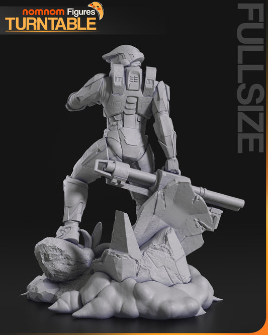 Back view of the Master Chief figurine standing on jungle terrain, holding a rifle over his shoulder, showing armored back details and base elements.