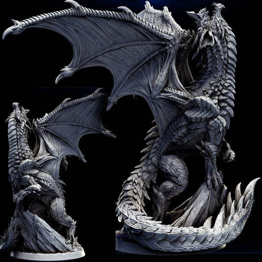 Adolescent Blue Dragon perched on a rocky base, wings spread wide, showcasing its detailed scales and powerful stance.