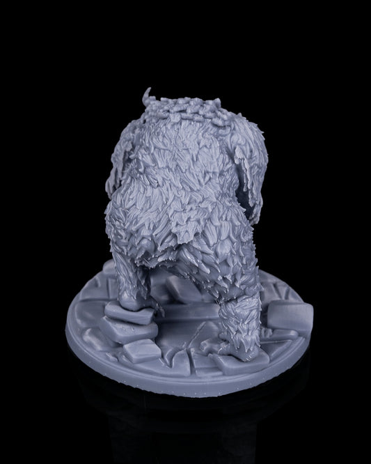 Owlbear miniature rear view from Beldrad's Bag of Beasts showing layered feathers, muscular limbs, taloned feet, and low stalking posture, avian ogre monstrosity for tabletop roleplaying games