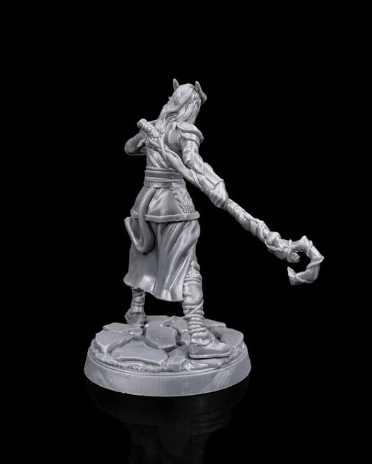 Tiefling druid hero miniature rear view from Beldrad's Bag of Beasts showing flowing hair and garments, agile movement pose, and wild shapeshifter energy for tabletop roleplaying games