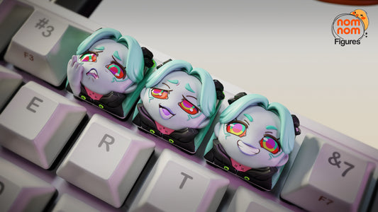 Wide shot of the full mechanical keyboard featuring Rebecca’s keycaps in the top row among standard keys, with visible NomNom branding.