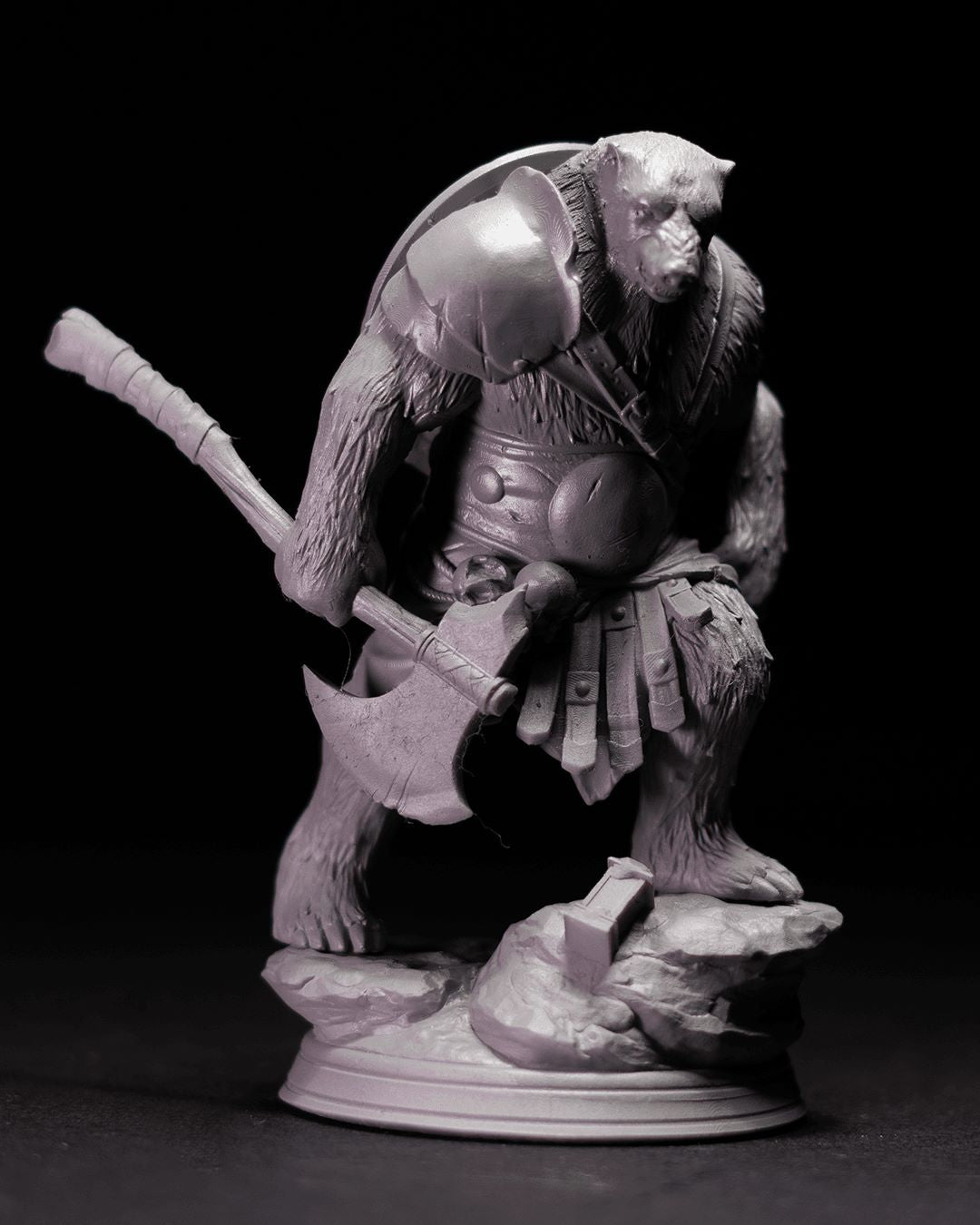 Polar the Bear miniature depicted as a formidable bear warrior holding a large axe, dressed in armor with a shield on his back, standing on a rocky base with a determined expression.