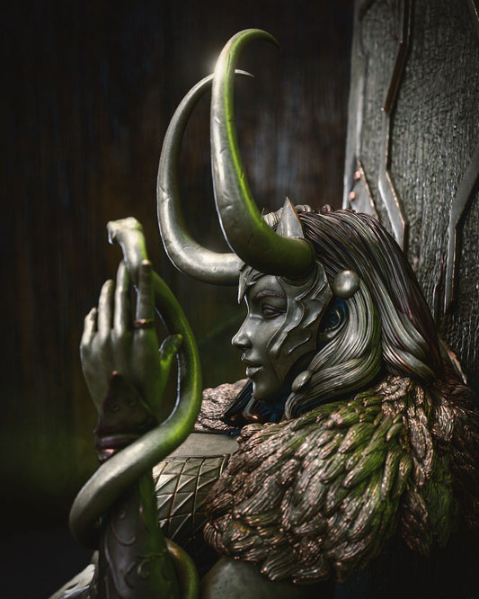 Close-up of Lady Loki, adorned with horns and a snake, wearing intricate armor and a fur cloak, gazing thoughtfully.