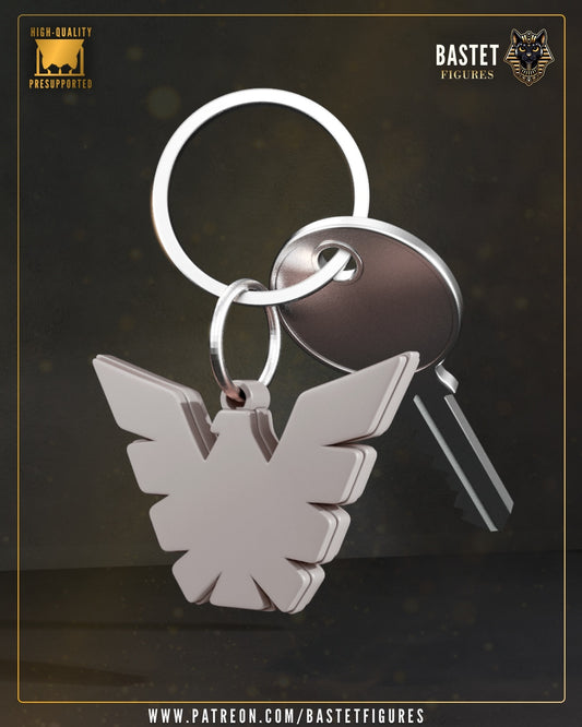 Dark Phoenix Marvel X-Men emblem keychain with phoenix bird logo pendant attached to metal keyring.