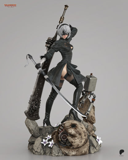 Alternate full view of 2B painted model in her signature outfit, holding her sword and accompanied by Pod 042 on a scenic ruined base with machine head and lilies.