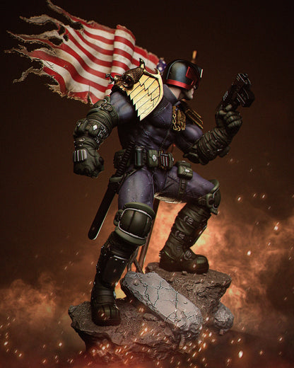 Angled side view of Judge Dredd statue showing right arm raised with gun and full display of shoulder armor and base debris.