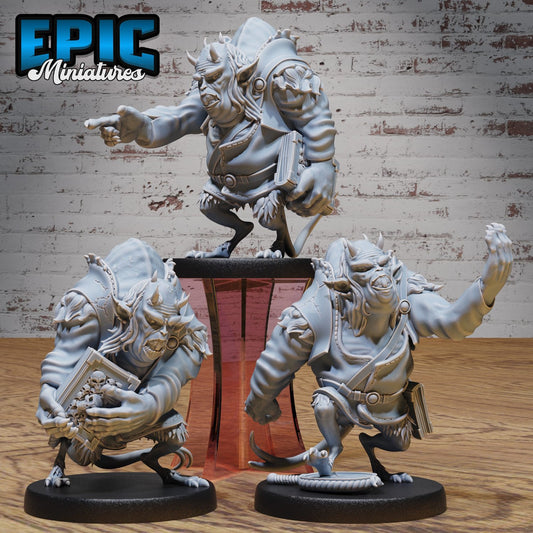 Three Hunchback Fiend miniatures, each with a distinct pose: one pointing, one clutching a book, and one gesturing dramatically, all displaying devilish expressions and twisted features.