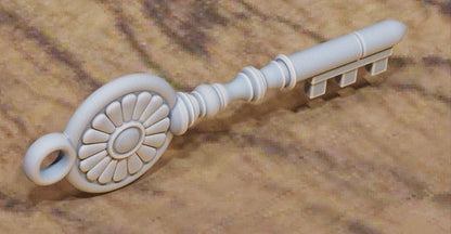 Key with circular floral‑medallion bow and straight shaft.