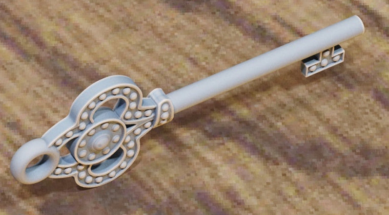 Key with large shell fan bow and ridged stem.