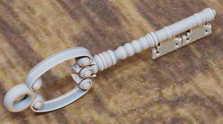 Key with oval loop bow, beaded collar, and grooved shaft.