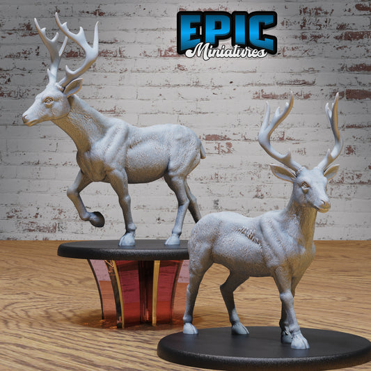 Dual deer minis in passive and walking poses, antlers high and sass higher, displayed on 51mm bases.