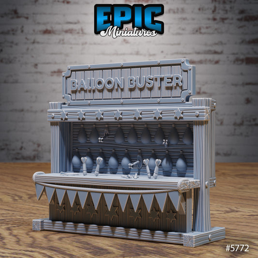 Balloon Buster miniature showing carnival booth with balloon targets, dart props, and detailed star-trimmed counter for tabletop terrain.