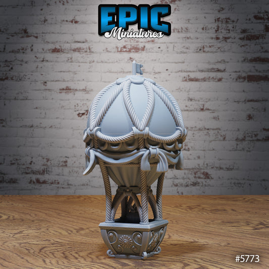 Hot Air Balloon miniature with detailed ropes, basket base, and decorative fabric accents, designed for fantasy carnival or fairground terrain.