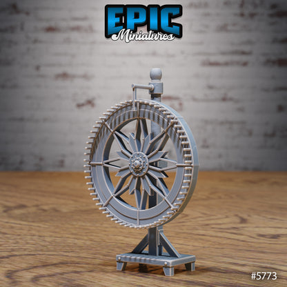 Wheel of Fortune miniature prop featuring a detailed spoked wheel on a wooden stand, perfect for carnival or fairground terrain.