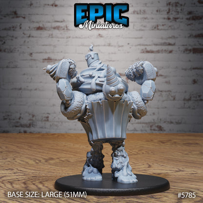 Mr. Sweets Candy Golem miniature raising its frosting-covered arms in an attack pose, designed with dripping icing details and candy-like textures for fantasy tabletop play.
