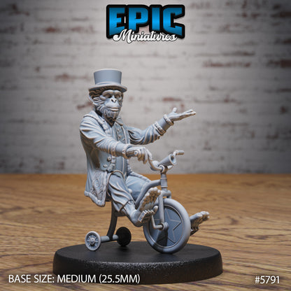 Monkey Director miniature riding a unicycle, wearing a detailed jacket and top hat, posed with one hand extended and the other on the handlebars, designed for fantasy tabletop use.