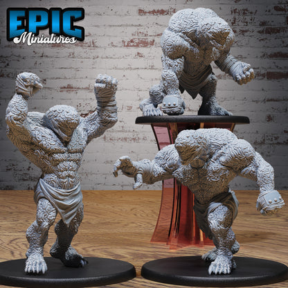 Set of three Brain Golem miniatures in different poses—crouching, charging, and smashing—each with grotesque brain-textured bodies on large 51mm bases.