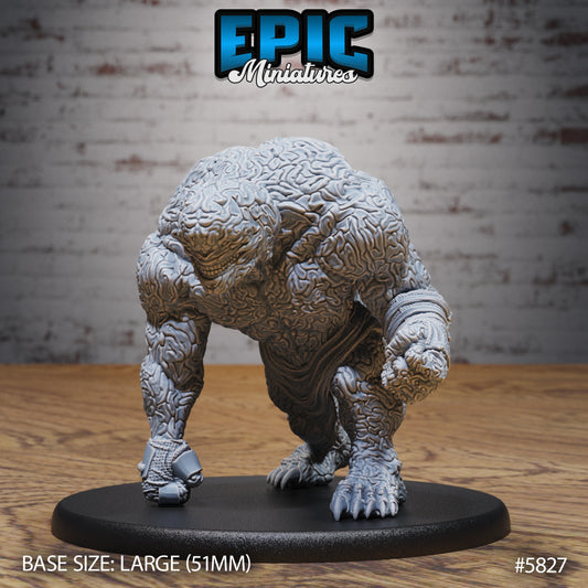 Front view of the Brain Golem miniature, a hulking aberration with brain-textured skin, crouched on a 51mm base.