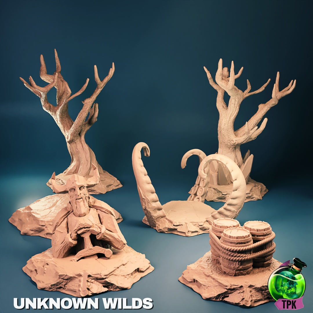 Fantasy wilderness scatter terrain group featuring twisted dead trees, stone formations, root-covered archway, barrels, and rocky bases, suitable for forest, cursed lands, or untamed wilderness tabletop RPG environments