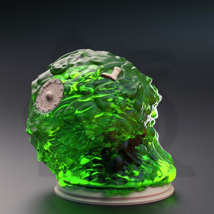 Gelatinous Sphere miniature, depicted from the side, with adventurer remnants like a shield and boot visible within the gelatinous mass. Suitable for adding a dungeon obstacle to your TTRPG adventures in Pathfinder or Dungeons & Dragons.